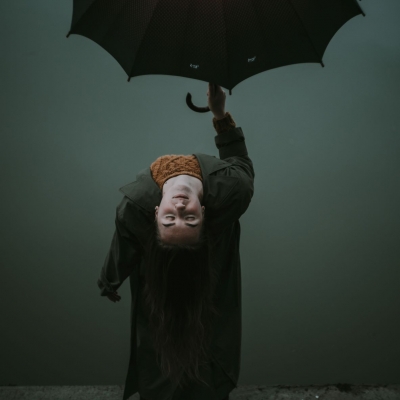 genuine person holding umbrella